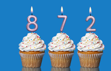 Birthday Cupcakes With Candles Lit Forming The Number 872