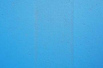 Artistic representation of a blue wall, emphasizing texture and depth.