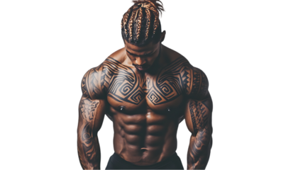 A muscular man with intricate tattoos poses confidently, showcasing strength.