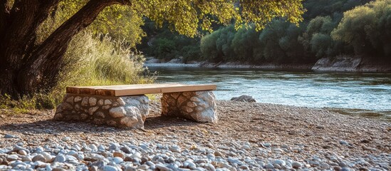 Peaceful riverside respite with a stone bench overlooking a tranquil stream surrounded by lush autumn foliage in a serene woodland setting