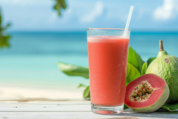 Obraz premium Refreshing Guava Juice in a Glass with Guava Slices and Straw, Tropical Beverage in a Beach Setting