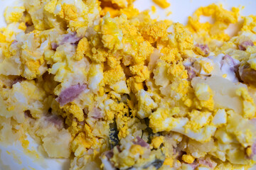 mixing the ingredients of the egg sandwich