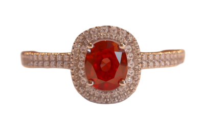 A stunning ring featuring a large red gemstone surrounded by smaller diamonds.