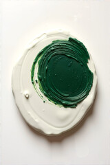 Creative Circular Green Paint Swirl on White Surface Abstract Artistic Background Design Element for Modern Minimal Art Concept