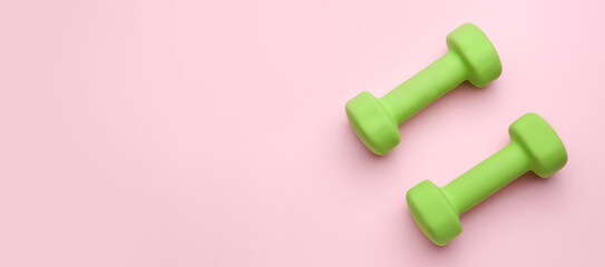 New dumbbells on color background