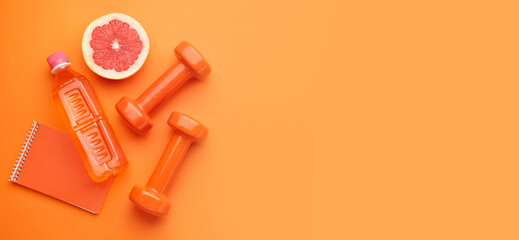 Dumbbells with notebook, grapefruit and bottle of water on color background