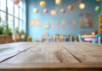 Empty wooden table top with a blurred background of a children's playroom in the morning