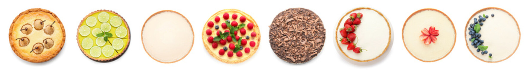 Set of delicious cheesecakes on white background, top view