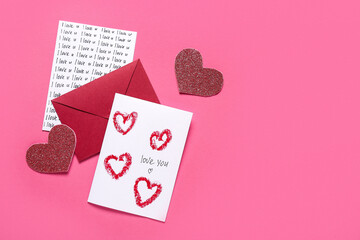 Composition with greeting cards, envelope and hearts on pink background. Valentine's Day celebration