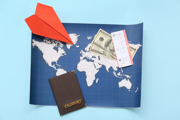 Composition with world map, paper plane, passport and ticket on color background