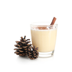 Glass of tasty eggnog cocktail with cinnamon and pine cones on white background