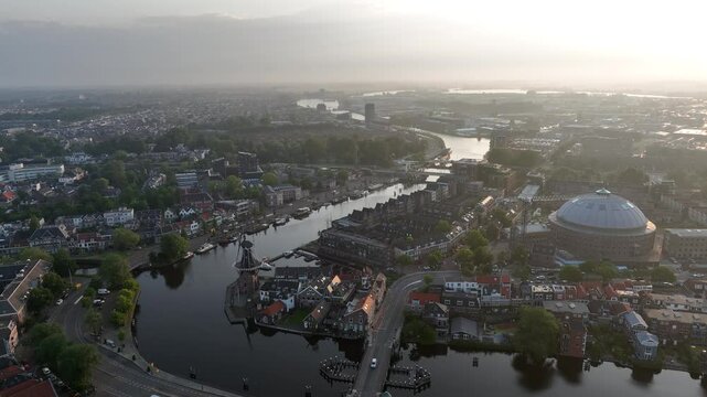 Cinematic aerial video of the Dutch city of Haarlem with Spaarne river curving through the cityscape
