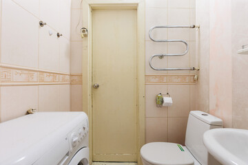 modern bathroom room with toilet and washing machine