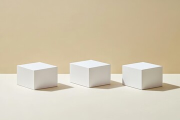 Fototapeta premium Three White Cubic Display Stands on Beige Background