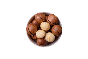 Delicious nutritious macadamia nuts in ceramic bowl