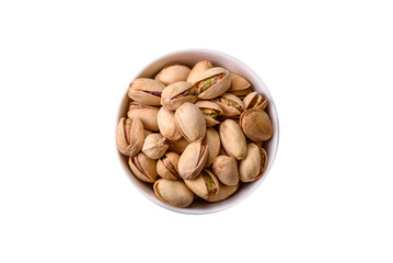 Delicious nutritious pistachio nuts in ceramic bowl