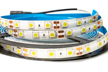 LED strip for room lighting on a black reel. Power supply for connecting the LED strip to an...