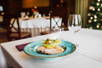 Grilled fish over blackened pasta and large mushroom ravioli. Italian recipes, restaurant food. 