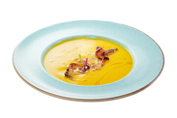 Pumpkin soup, cream of corn, aromatic warming soup with slices of fried bacon. White background.