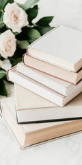Stack of books with white flowers, lifestyle aesthetic background