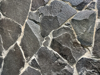 Natural black flagstone or flattened flag stones, irregular shape cobble stone but cut and paved...
