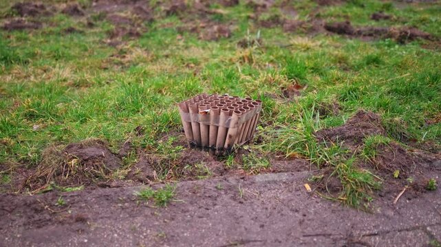 accident, air pollution, box launcher, cardboard tubes, cartridge, celebration, celebration litter, celebration remnants, cylinder, danger, discarded fireworks, empty, environmental impact, explosive,