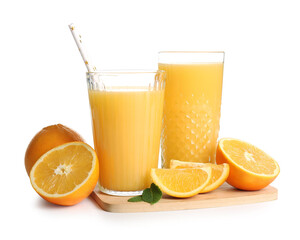 Glasses of fresh orange juice with mint and fruits on white background