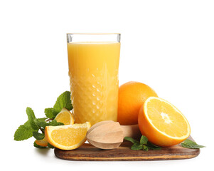 Glass of fresh orange juice with mint and wooden juicer on white background