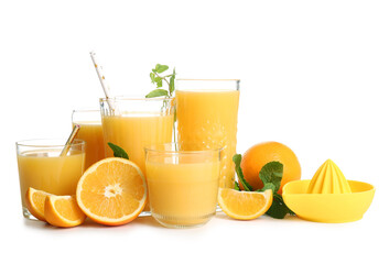 Glasses of fresh orange juice with mint and fruits on white background