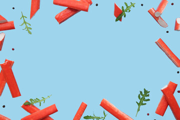 Frame made of tasty crab sticks with arugula leaves and peppercorns flying on blue background © Pixel-Shot