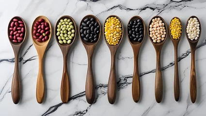 Beans and lentils in wooden spoon on teak wood 4k background © Samad