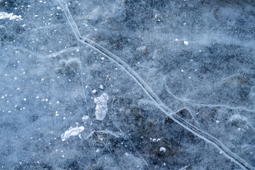 Detail of ice cracks on a frozen lake