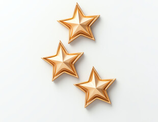 Obraz premium Three golden stars intricately designed on a clean white background, capturing a sense of elegance and simplicity