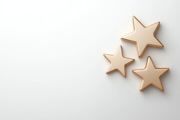Obraz premium Three golden star shapes elegantly placed against a soft white background