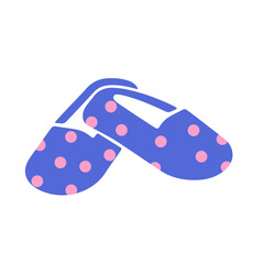 A pair of blue flip flops with pink polka dots