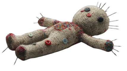 Close-Up of a Handmade Voodoo Doll with Button Eyes and Pins