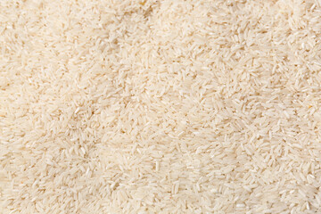 Texture of raw rice as background