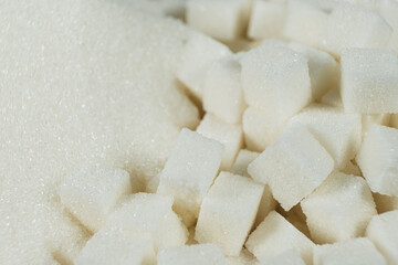 White refined beet sugar in the form of crystals and cubes.