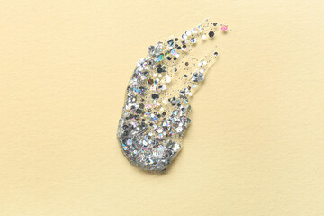 Silver glitter stroke on beige background