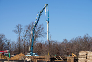 truck crane concrete mixer pours foundation