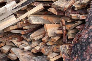 Broken boards. Pile of wet boards at the sawmill. Selective focus