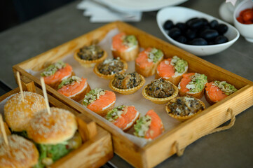 Buffet table. Snacks for the banquet. Meat and fruit plates