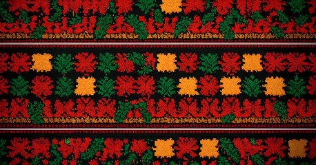 Seamless slavic traditional floral embroidery pattern with red and green elements on black background