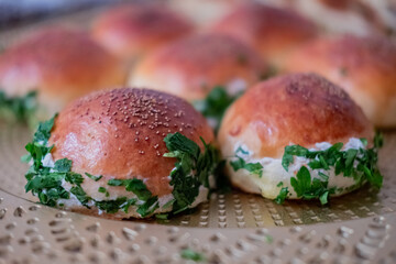 Parsley and cheese pastry in a golden plate