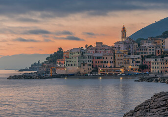 Fototapeta premium A Coastal Village at Dusk, Featuring Serene Waters and Stunning Scenery All Around You