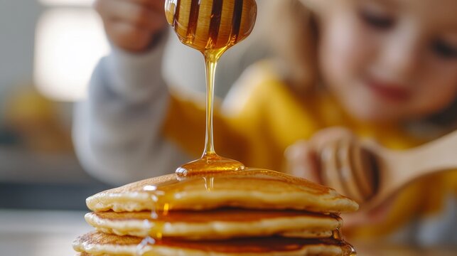 Highly stacked pancakes with honey drizzle, perfect for a warm breakfast or brunch setting