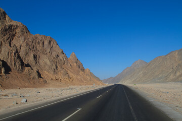 road in the mountains of the desert. travel to Africa, extreme adventures or science expedition in a stone desert. 