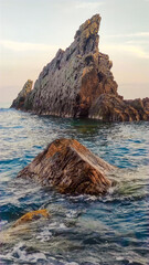 Rocky Shoreline at Galeazza Beach Imperia, Italy, at Sunset