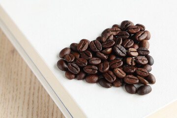 Closeup heart coffee beans with shallow depth