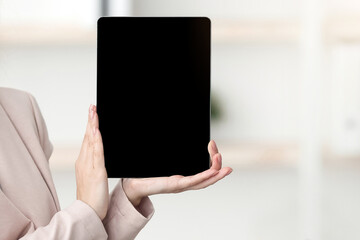 Tour Agent In Face Mask Showing Empty Digital Tablet Screen To Black Tourists Couple Offering Family Vacation Sitting In Modern Office. Touristic Agency Services And Offers. Selective Focus, Mockup